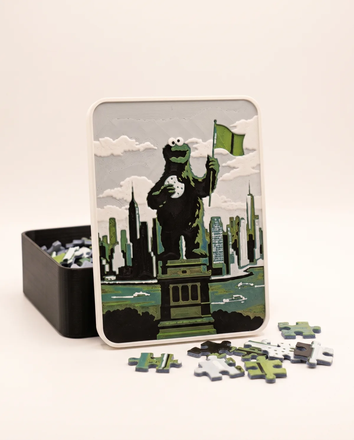 3D printed gift box with a multi-colour photo relief of a child on the lid, puzzle pieces next to it